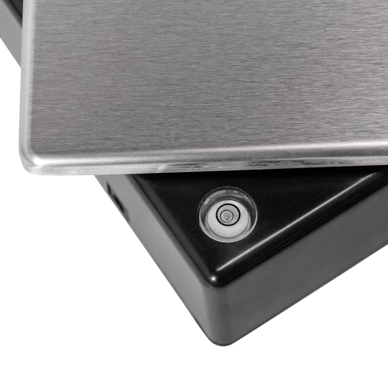 The corner of an Escali lab balance with its spirit level